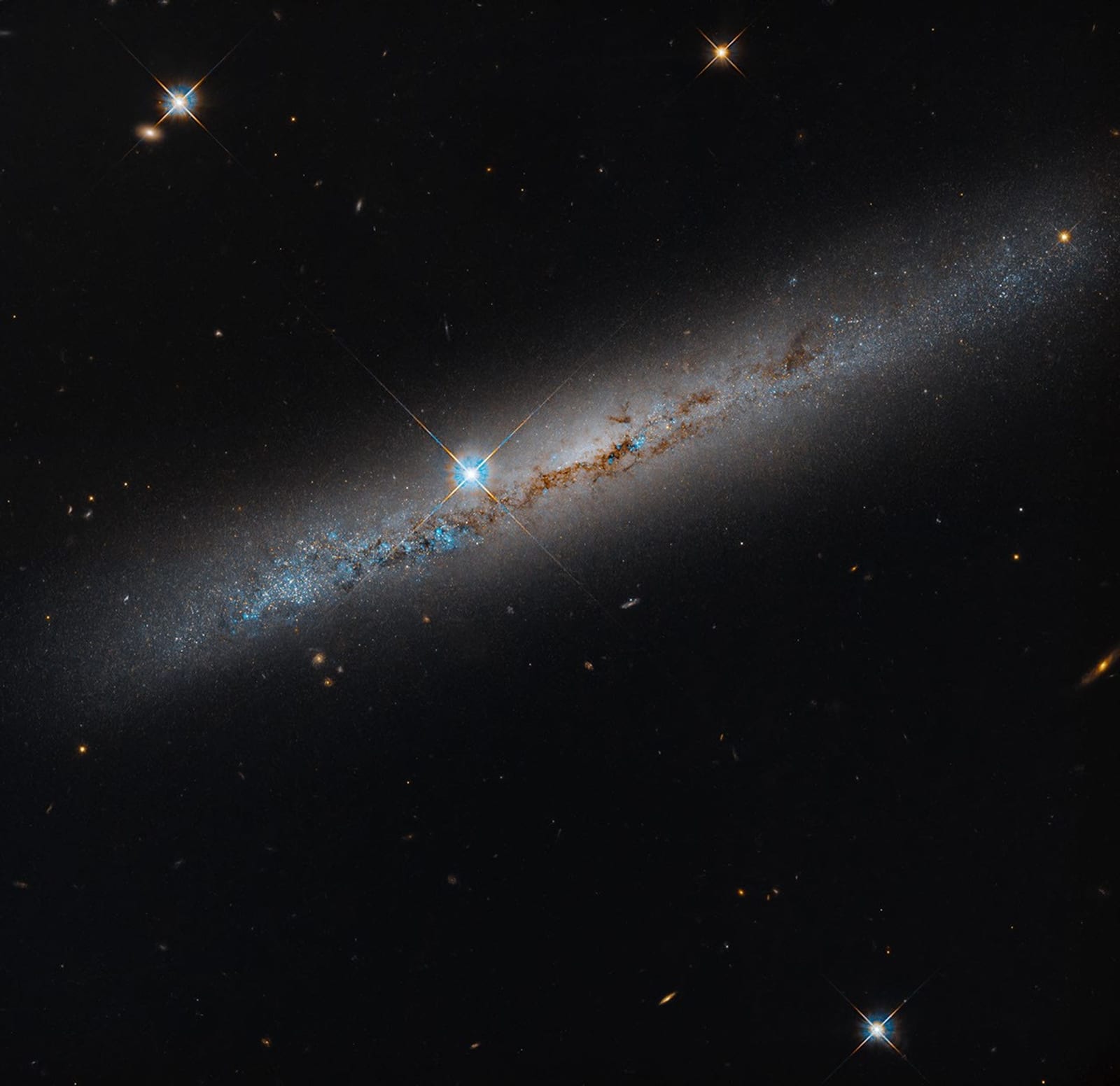 NASA’s Hubble Spies Spiral’s Edge